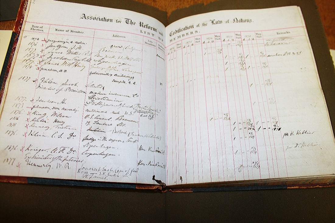Brown leather bound ledger handwritten black ink names of members of Association for the Reform and Codification of the Law of Nations, 1874-1878
